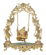 Brass Radha Krishna swing statue, close view of gold swing frame and seated figure
