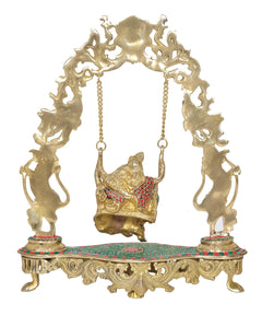 Brass Radha Krishna swing statue, close view of gold swing frame and seated figure