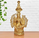 Brass Devi Padmavati showpiece with seated figure, ornate halo design, golden finish
