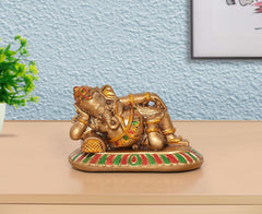 Resin relaxing Ganesha statue, seated with trunk curled, multicolor detailing on base