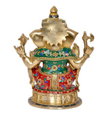 Brass Ganesha idol back view, gold silhouette, colorful robe patterns, round base