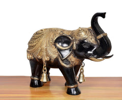 Brass elephant figurine, front-left view, gold saddle pattern and two hanging bells