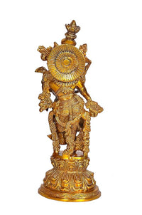 Gold-tone brass Radha Rani idol sculpture with radiant halo design behind the figure.