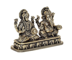 Brass Lakshmi and Ganesha idol figurines, seated side view with ornate jewelry