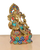 Ganesha brass idol angled view with jeweled crown and teal-red-blue draped ornaments