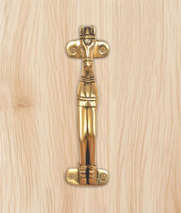 Gold brass horse head door handle close-up with engraved details and screw heads