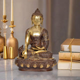 Brass Buddha statue in dhyan mudra, gold face and bronze robe, seated on ornate base