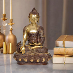 Brass Buddha statue in dhyan mudra, gold face and bronze robe, seated on ornate base