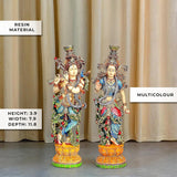 Resin Radha-Krishna statues in multicolor with detailed jewelry and patterned garments