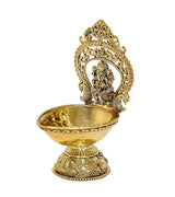 Gold brass Ganesh diya oil lamp, side profile with crowned deity and stand
