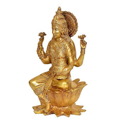 Side view brass Lakshmi statue seated on lotus, intricate jewelry details