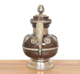 Himalayan brass teapot from side view, decorative embossing on body and domed lid