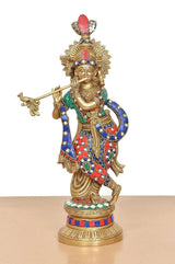 Brass Krishna flute idol, full view with ornate crown and multicolor robe
