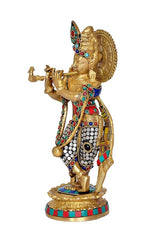 Brass Krishna idol with blue and red inlay, raised hand pose on round base