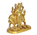 Brass Trimurti statue on cow, profile angle, layered robes and multiple faces