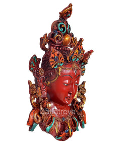 Tara wall hanging mask, 3/4 view of red face with jeweled gold and teal ornaments