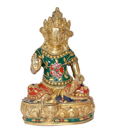 Brass Kuvera statue with raised hand, green outfit, red floral motifs, gold ornaments