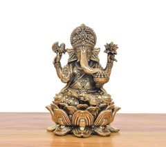 Bronze Lord Ganesha murti with crown and four arms, seated on lotus base