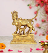 Brass Kamadhenu cow statue with wings, calf figure, detailed pedestal for pooja decor