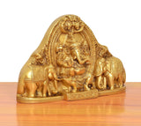 Brass Gaja Ganesha idol with elephants, angled view, golden finish