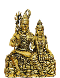 Golden brass Shiva and Parvati idol, detailed faces, seated pose on lotus base