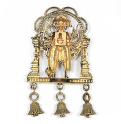 Bronze Panchmukhi Hanuman idol on arch with three hanging bells below, alternate angle.