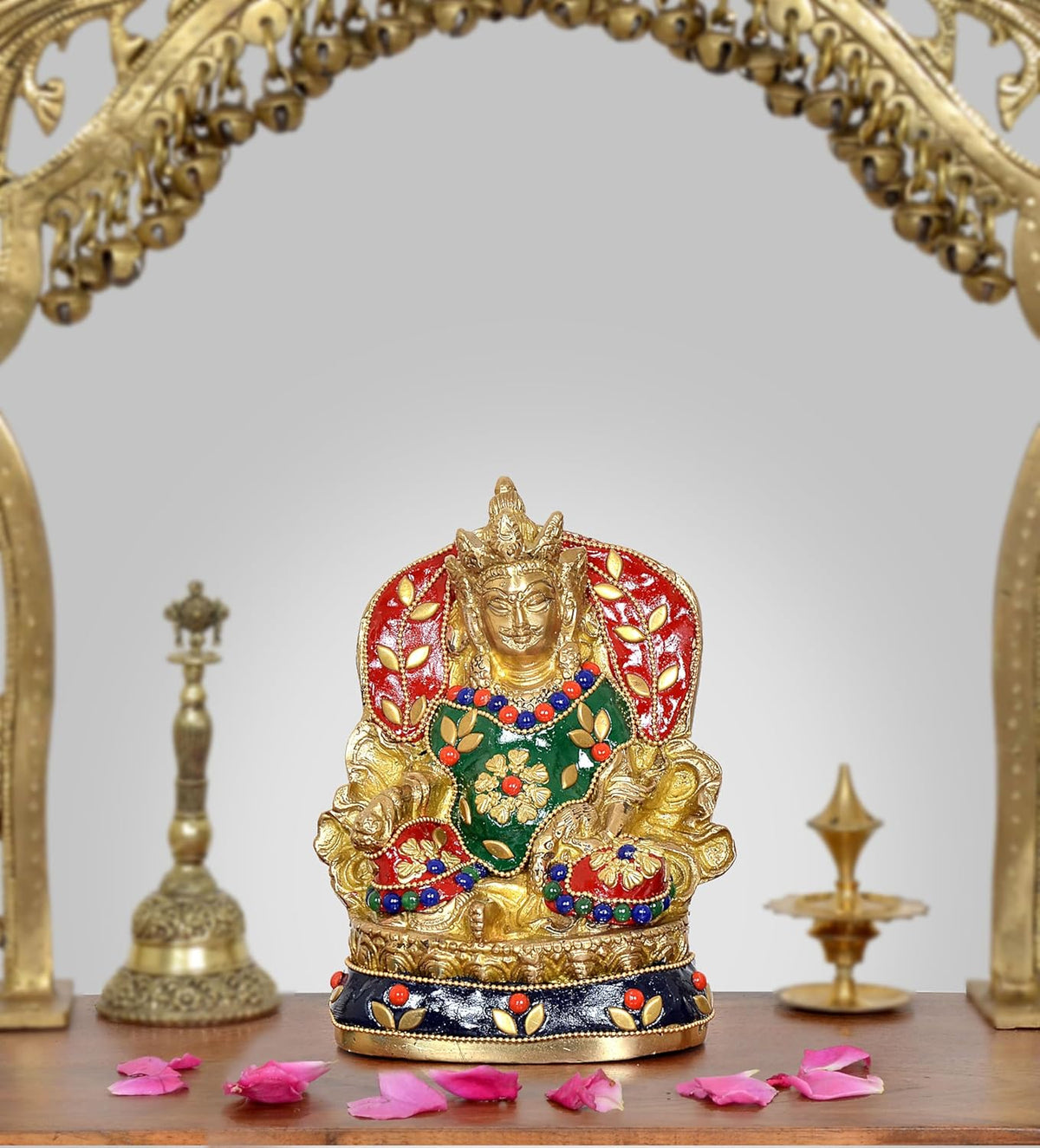 Antique brass Kubera statue, red halo, green-and-blue ornament, seated