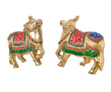Brass cow pair wall hanging, angled view showing faces, horns and decorated chest panels