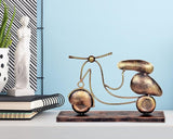 Iron scooter table top collectible with three wheels, bronze finish on dark base