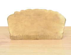 Brass comb back view with sculpted top and straight comb teeth