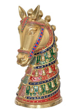 Brass horse figure with raised ears, multicolor painted costume, angled view