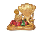 Rear view of Vishnu and Lakshmi statue, Sheshnag hood spread behind, gold detailing