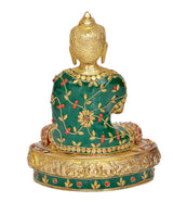 Brass Buddha statue, back view, green robe with gold details and jeweled circular base
