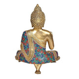 Brass Buddha idol back view, ornate crown and patterned blue-red robe