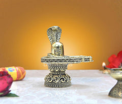 Brass shivling figurine with cobra hood and ornate pedestal, height 4 inch.