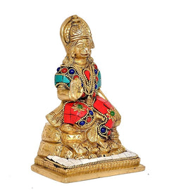 Brass Lord Hanuman statue, three-quarter view, turquoise and red jewelry details, on pedestal