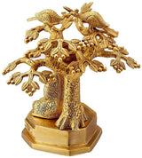 Brass Buddha statue under Bodhi tree, seated figure with detailed trunk, rear view