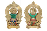 Back view of brass Lakshmi and Ganesh idols with detailed halo arches and colorful clothing