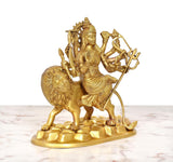 Side view: golden brass Durga Maa on lion with ornate weapons, 9 inch