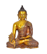 Gold Buddha statue meditating, left hand raised, detailed brown robe and decorative base
