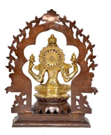 Brass Lakshmi idol rear view with halo wheel details, seated on lotus base