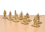 Brass Navdurga idol statues on square bases, clustered arrangement