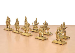 Brass Navdurga idol statues on square bases, clustered arrangement