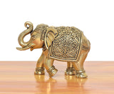 Bronze elephant statuette with raised trunk, floral embossing on back panel