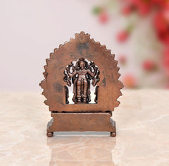 Copper Vishnu statue back view with halo panel and standing deity on base