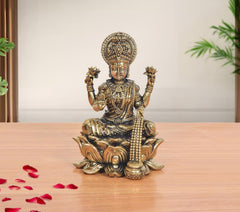Seated Lakshmi brass goddess idol, detailed crown and raised hands on lotus base