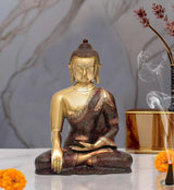 Brass Buddha statue meditating with hands in dhyana mudra, seated on ornate base
