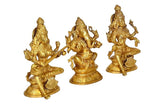 Brass deity trio figurines: Ganesh, Lakshmi, Saraswati, three-quarter view