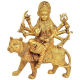 Brass Durga Mother Goddess statue, seated on lion with four arms raised