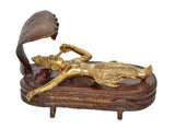 Brass Vishnu yoga nidra figurine on round base, cobra hood raised, hands crossed
